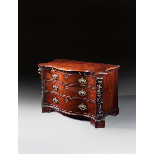 A PAIR OF GEORGE II PERIOD SERPENTINE FRONTED MAHOGANY COMMODES ATTRIBUTED TO THE WORKSHOP OF WILLIAM VILE OR WILLIAM HALLETT THE CARVING POSSIBLY BY JOHN BOSON